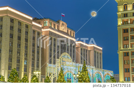 Christmas and New Year holidays illumination at night, with the super moon, Moscow, Russia--Building of The State Duma of the Federal Assembly of Russian Federation Christmas and New Year holidays illumination at night, with the super moon, Moscow, Russia--Building of The State Duma of the Federal Assembly of Russian Federation 134737018