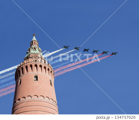 Moscow Kremlin, Russia -- Victory Day celebration (WWII), and Russian military aircraft with painted russian flag, Russia Moscow Kremlin, Russia -- Victory Day celebration (WWII), and Russian military aircraft with painted russian flag, Russia 134737020