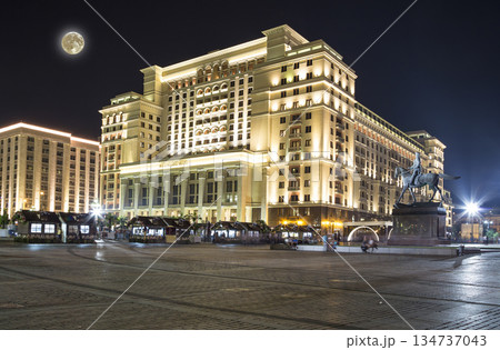 Four Seasons Hotel Moscow (with the super moon) in Manege Square. Moscow, Russia.This is modern luxury hotel with facade that replicates the historic Hotel Moskva. 134737043