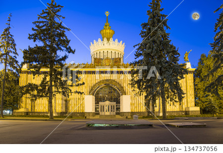 Landmarks in the territory of VDNKh (All-Russia Exhibition Centre, also called All-Russian Exhibition Center) with the super moon --  is a permanent general-purpose trade show in Moscow, Russia 134737056