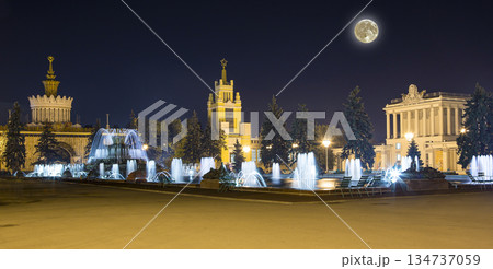 Landmarks in the territory of VDNKh (All-Russia Exhibition Centre, also called All-Russian Exhibition Center) with the super moon --  is a permanent general-purpose trade show in Moscow, Russia 134737059