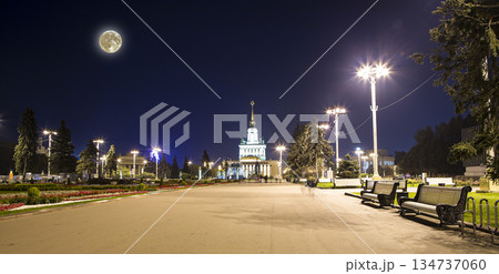 Landmarks in the territory of VDNKh (All-Russia Exhibition Centre, also called All-Russian Exhibition Center) with the super moon --  is a permanent general-purpose trade show in Moscow, Russia 134737060