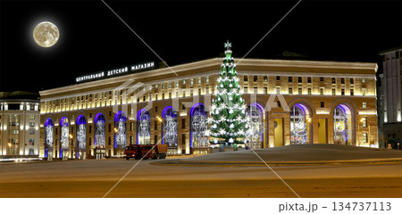 Christmas (New Year holidays) illumination of the Central Children's Store on Lubyanka (inscription in Russian) at night, with the super moon, Moscow, Russia 134737113