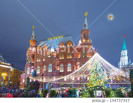 Christmas (New Year holidays) illumination and State Historical Museum (It is written in Russian) at night (with the super moon), near the Kremlin  in Moscow, Russia 134737357