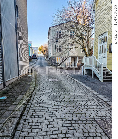 Quiet Cobblestone Street Between Traditional Wooden Houses Quiet Cobblestone Street Between Traditional Wooden Houses 134737655