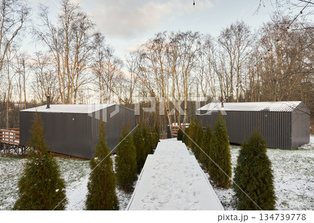 Modern small homes with sleek facades and scenic environment 134739778