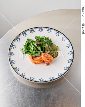 Healthy mixed greens embellished with pickles and citrus vinaigrette 134739805