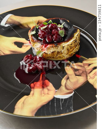 food stylist arranging berry cheesecake for shared tasting food stylist arranging berry cheesecake for shared tasting 134739811