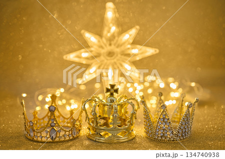 Three golden crowns representing epiphany and three wise on glitter background Three golden crowns representing epiphany and three wise on glitter background 134740938
