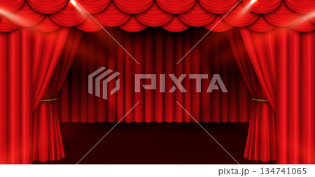 Red stage curtain with dramatic spotlight beams 134741065