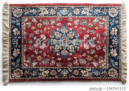 Handwoven Persian rug texture on a white background. Top view. 134741113