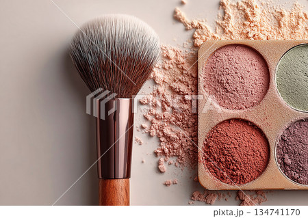 Best-selling color schemes for makeup. Flat lay of makeup brush placed next to a color palette on white background. Best-selling color schemes for makeup. Flat lay of makeup brush placed next to a color palette on white background. 134741170