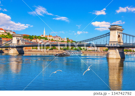 Famous Chain Bridge with Matthias Church at sunny day, Budapest, Hungary Famous Chain Bridge with Matthias Church at sunny day, Budapest, Hungary 134742792