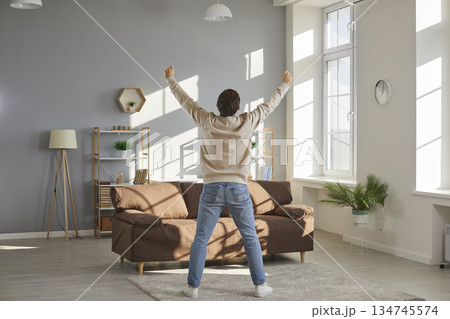Happy funny husband and father is alone at home, enjoying freedom and having fun Happy funny husband and father is alone at home, enjoying freedom and having fun 134745574
