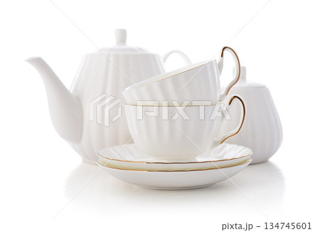 Two white golden rimmed porcelain tea cups with saucers, a bone china teapot and a sugar bowl Two white golden rimmed porcelain tea cups with saucers, a bone china teapot and a sugar bowl 134745601