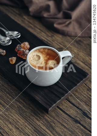 Two cups  of coffee on wooden tray 134745620