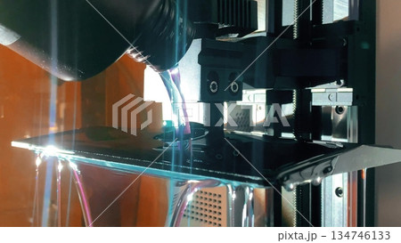 Pouring liquid resin into 3d printer vat before starting SLA printing process 134746133