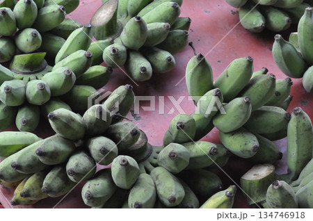 Green banana bunch tropical fruit fresh organic market raw ripe healthy agriculture Green banana bunch tropical fruit red 134746918