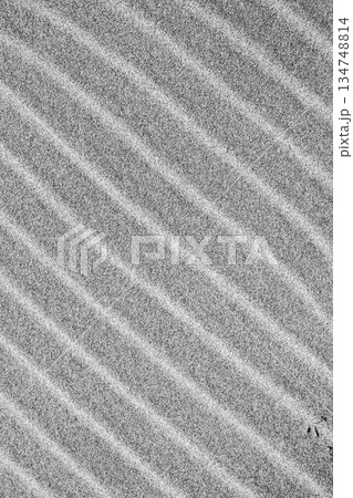 Intricate patterns form in the sand 134748814