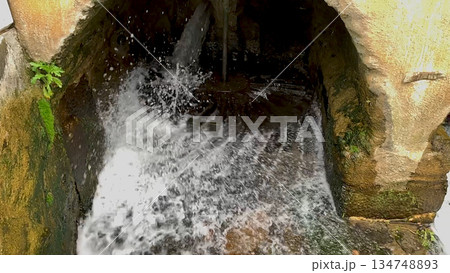 Slow motion of working water mill 134748893