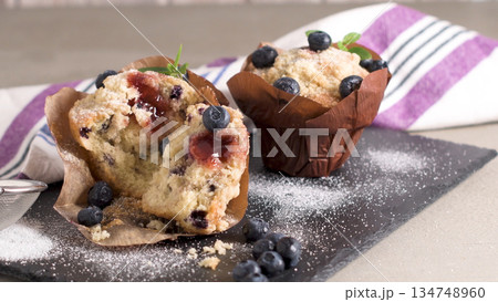 Muffins with red fruits jam fill Muffins with red fruits jam fill 134748960