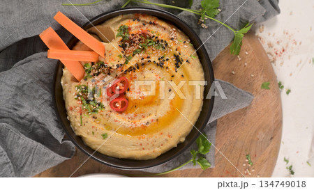 Delicious hummus in ceramic bowl 134749018