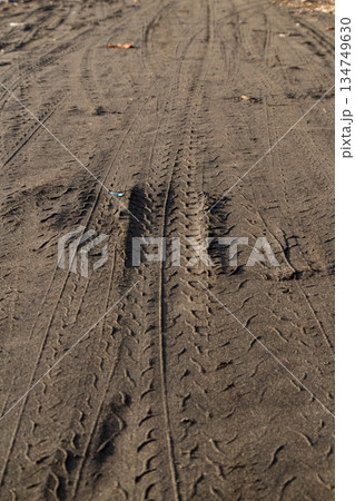 Tire Tracks in the Dirt Road Showing Tread Pattern Detail, Transportation and Industry, Off-Roading and Automotive Concept Tire Tracks in the Dirt Road Showing Tread Pattern Detail, Transportation and Industry, Off-Roading and Automotive Concept 134749630