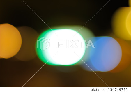 Abstract colorful blurred bokeh lights at night with slow shutter speed creating circular shapes ideal for festive backgrounds and wallpapers 134749752