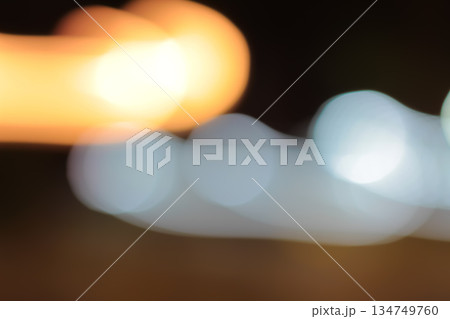 Blurred Light Streaks with Slow Shutter Speed Creating Abstract Patterns for Artistic Effects and Night Photography Concepts Blurred Light Streaks with Slow Shutter Speed Creating Abstract Patterns for Artistic Effects and Night Photography Concepts 134749760