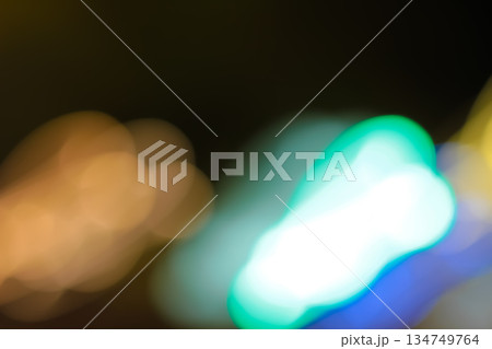 Abstract blurred light trails of colorful bokeh with slow shutter speed for vibrant urban night scene or motion effect background, artistic expression Abstract blurred light trails of colorful bokeh with slow shutter speed for vibrant urban night scene or motion effect background, artistic expression 134749764