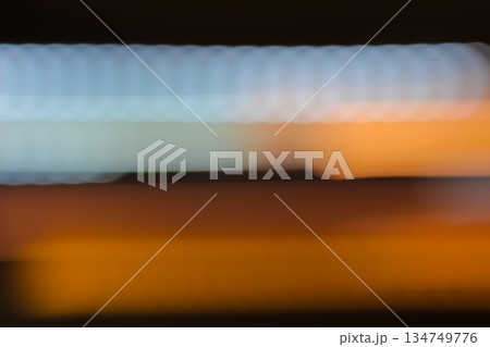 Abstract light trails in motion with slow shutter speed effect creating blurred colorful lines for dynamic and artistic backgrounds 134749776