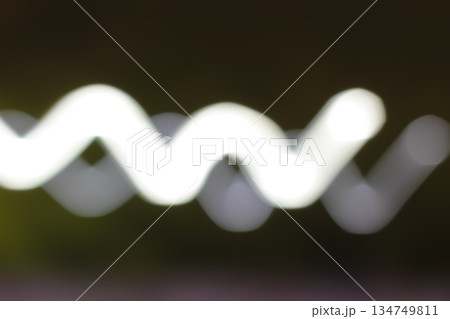 Blurred Light Streaks with Slow Shutter Speed Creating Zigzag Pattern, Illustrating Motion and Energy for Abstract Backgrounds or Creative Designs Blurred Light Streaks with Slow Shutter Speed Creating Zigzag Pattern, Illustrating Motion and Energy for Abstract Backgrounds or Creative Designs 134749811