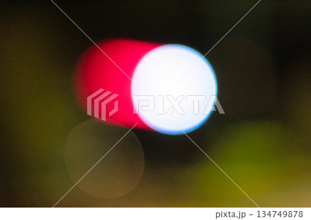Abstract Bokeh Light Effect: Red and White Spheres Floating in Dark Ambiance, Perfect for Creating Dreamy and Ethereal Visuals in Graphic Design Projects 134749878