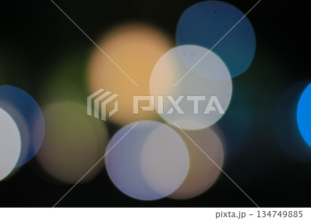 Abstract Bokeh Lights Background with Soft Focus, Colorful Circular Shapes and Dark Backdrop for Festive Season and Creative Design 134749885