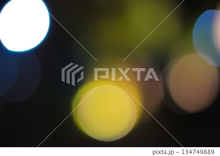 Defocused City Lights at Night Creating Bokeh Effect with Circular Shapes and Soft Glow for Festive Backgrounds 134749889