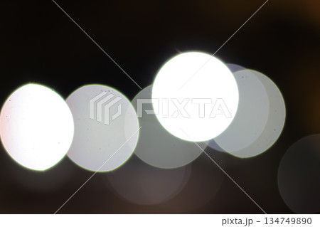 Blurred White Bokeh Lights Abstract Background Creating a Dreamy, Soft Focus Effect for Festive or Artistic Projects Blurred White Bokeh Lights Abstract Background Creating a Dreamy, Soft Focus Effect for Festive or Artistic Projects 134749890