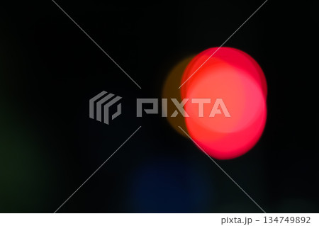 Abstract Red Bokeh Light Effect on Black Background, creating a visually appealing and modern design element for creative projects 134749892