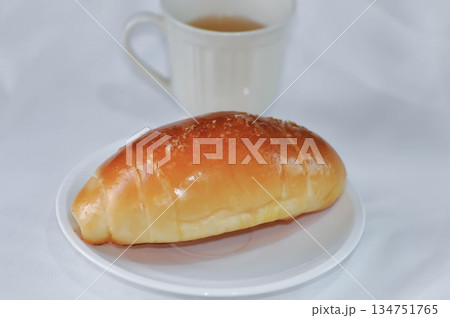 Shio Pan, Salzstangerl bread or Austria bread or Japanese bread and hot tea Shio Pan, Salzstangerl bread or Austria bread or Japanese bread and hot tea 134751765