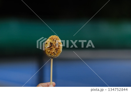Grilled sticky rice, molded into a round shape. Grilled sticky rice, molded into a round shape. 134752844