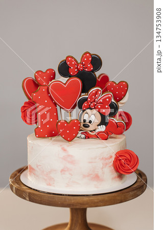 This delightful Mickey Mouse birthday cake features vibrant and colorful decorations that are just perfect for celebrating a first birthday, making it an exceptionally festive addition to any party This delightful Mickey Mouse birthday cake features vibrant and colorful decorations that are just perfect for celebrating a first birthday, making it an exceptionally festive addition to any party 134753908