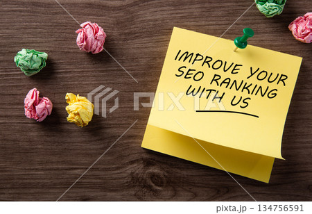 Marketing memo improving seo ranking on wooden desk 134756591
