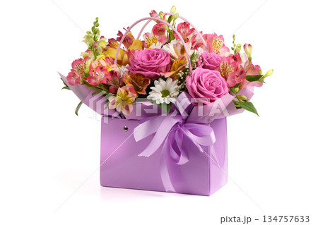 A bouquet and a violet bag with handles white background. Bouquet of flowers, chrysanthemum, rose, lily, carnation. 134757633