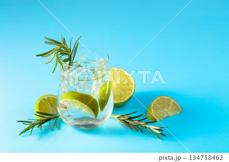 Summer refreshing drink with ice, lime and rosemary. 134758462