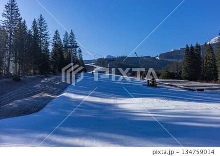 Empty groomed ski slope in Jasna Low Tatras resort, Slovakia. 134759014