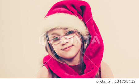 Christmas girl in santa hat festive outfit 134759415