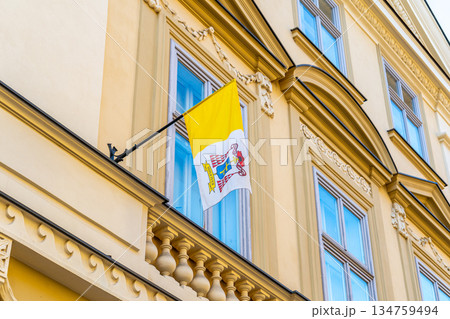 Yellow flag of the Vatican on the wall of building Yellow flag of the Vatican on the wall of building 134759494