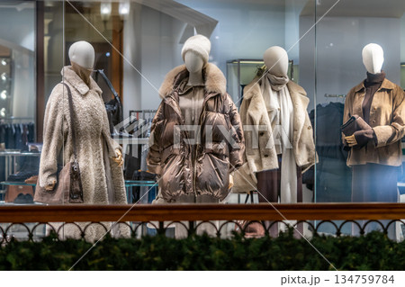 Winter Fashion Display Of Cozy Coats And Accessories In A Boutique Window 134759784