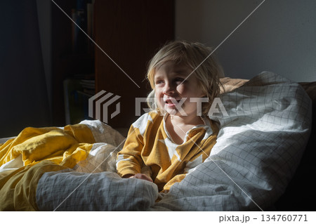 Girl Relaxing on Sofa and Fooling Around at Home on Weekend Girl Relaxing on Sofa and Fooling Around at Home on Weekend 134760771