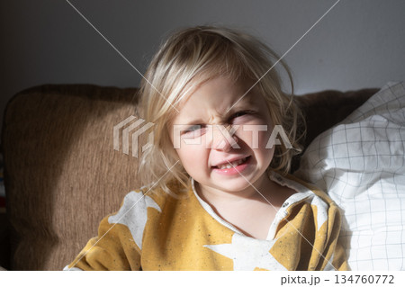 Girl Relaxing on Sofa and Fooling Around at Home on Weekend Girl Relaxing on Sofa and Fooling Around at Home on Weekend 134760772
