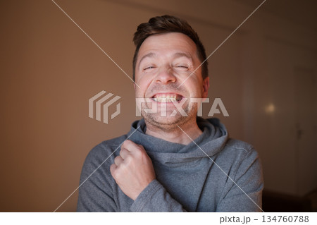 Middle Aged European Man with a Wide Fake Smile, Emotional Portrait 134760788